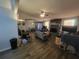 Bright living room with stone fireplace, modern ceiling fan, and updated floors at 3321 Border Dr, Stone Mountain, GA 30087