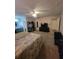 Spacious main bedroom with a ceiling fan, a tv and a door to the bathroom at 3321 Border Dr, Stone Mountain, GA 30087