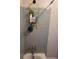 Shower featuring shower head, fixtures and shelving for accessories at 3321 Border Dr, Stone Mountain, GA 30087