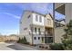 Modern townhome with white and tan exterior, private balcony, and detached garage at 1074 Crest Se Cir, Atlanta, GA 30312