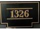 Black and gold apartment number plaque at 870 Mayson Turner Rd # 1326, Atlanta, GA 30314