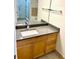 Bathroom with wood vanity and granite countertop at 870 Mayson Turner Rd # 1326, Atlanta, GA 30314