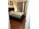 Bright bedroom with wood floors and a double bed at 870 Mayson Turner Rd # 1326, Atlanta, GA 30314