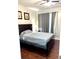 Bedroom with double bed, dark wood furniture and gray curtains at 870 Mayson Turner Rd # 1326, Atlanta, GA 30314