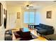 Living room with sectional sofa and large window at 870 Mayson Turner Rd # 1326, Atlanta, GA 30314
