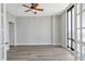 Light filled bedroom with luxury vinyl plank flooring and French doors with skyline views at 3475 Oak Valley Ne Rd # 1930, Atlanta, GA 30326