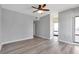 This primary bedroom boasts hardwood floors and a wall of windows at 3475 Oak Valley Ne Rd # 1930, Atlanta, GA 30326