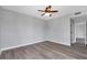 Spacious bedroom with hardwood floors and a view of the hall at 3475 Oak Valley Ne Rd # 1930, Atlanta, GA 30326