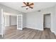 Open bedroom with beautiful floors, ceiling fan, and large french doors at 3475 Oak Valley Ne Rd # 1930, Atlanta, GA 30326