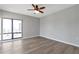 Bright, open bedroom features hardwood floors and a ceiling fan at 3475 Oak Valley Ne Rd # 1930, Atlanta, GA 30326