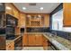 Kitchen with stainless steel appliances, stone backsplash and granite countertops at 3475 Oak Valley Ne Rd # 1930, Atlanta, GA 30326