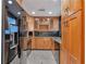 Kitchen with stainless steel refrigerator, wood cabinets, and granite countertops at 3475 Oak Valley Ne Rd # 1930, Atlanta, GA 30326