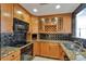 Kitchen featuring stainless steel appliances, granite counters and mosaic backsplash at 3475 Oak Valley Ne Rd # 1930, Atlanta, GA 30326