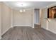 Living area with hardwood flooring, a bar area and tan walls and white trim along the floor and ceiling at 3475 Oak Valley Ne Rd # 1930, Atlanta, GA 30326