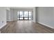 Living area with hardwood flooring, lots of light and white trim and grey walls at 3475 Oak Valley Ne Rd # 1930, Atlanta, GA 30326