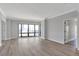 Living area with hardwood flooring, neutral colored walls and white trim at 3475 Oak Valley Ne Rd # 1930, Atlanta, GA 30326