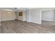 Open concept living room featuring updated vinyl plank flooring and neutral paint colors at 3475 Oak Valley Ne Rd # 1930, Atlanta, GA 30326