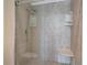 Tiled shower with seating, tile details and built in shelves at 3475 Oak Valley Ne Rd # 1930, Atlanta, GA 30326