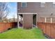 Nicely landscaped backyard with artificial turf and wooden fence. The home features exterior brown siding at 3000 Smyrna Grove Dr, Smyrna, GA 30082