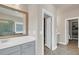 Bathroom featuring double vanity, a walk in shower and access to the walk-in closet at 3000 Smyrna Grove Dr, Smyrna, GA 30082