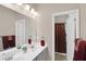Bright bathroom featuring a double sink vanity, large mirror, and decorative towels at 3000 Smyrna Grove Dr, Smyrna, GA 30082