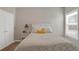 Inviting bedroom featuring neutral walls, a neatly arranged bed, and soft natural light at 3000 Smyrna Grove Dr, Smyrna, GA 30082