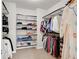 Walk-in closet with organized shelving and hanging racks for clothing and accessories at 3000 Smyrna Grove Dr, Smyrna, GA 30082