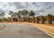 Gorgeous clubhouse with a pool surrounded by well-maintained landscaping and mature trees at 3000 Smyrna Grove Dr, Smyrna, GA 30082