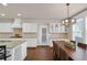 Elegant dining area features stylish lighting and open access to the kitchen at 3000 Smyrna Grove Dr, Smyrna, GA 30082