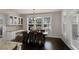 Open dining area with dark hardwood floors and large windows, ideal for Gathering meals at 3000 Smyrna Grove Dr, Smyrna, GA 30082