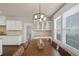 Well-lit dining room with views of the outdoors and easy kitchen access at 3000 Smyrna Grove Dr, Smyrna, GA 30082