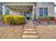 Inviting front entrance with stone steps leading to a charming porch and a beautifully decorated front door at 3000 Smyrna Grove Dr, Smyrna, GA 30082