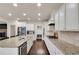 A gourmet kitchen features white cabinets, granite counters, stainless appliances, and a breakfast bar at 3000 Smyrna Grove Dr, Smyrna, GA 30082