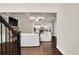 Bright and spacious living room with hardwood floors, a coffered ceiling, and an open view to the kitchen at 3000 Smyrna Grove Dr, Smyrna, GA 30082