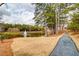 Relaxing community with a walking trail, mature trees, and a serene pond with fountain in the background at 3000 Smyrna Grove Dr, Smyrna, GA 30082