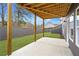 Covered patio with wood beams, a concrete floor, and a view of the fenced backyard at 386 10Th Unit 57 St, Auburn, GA 30011