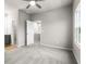 Spacious bedroom with carpeted floor, ceiling fan, and ample closet space at 386 10Th Unit 57 St, Auburn, GA 30011