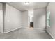 Spacious bedroom with carpet, window, and access to bathroom at 386 10Th Unit 57 St, Auburn, GA 30011