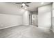Spacious bedroom with grey carpet and ceiling fan at 386 10Th Unit 57 St, Auburn, GA 30011