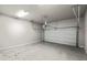 Empty garage with automatic garage door at 386 10Th Unit 57 St, Auburn, GA 30011