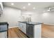 Modern kitchen with island, stainless steel appliances, and dark countertops at 386 10Th Unit 57 St, Auburn, GA 30011