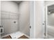 Laundry room with built in shelving and drain at 386 10Th Unit 57 St, Auburn, GA 30011