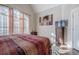 Bedroom with large windows, a TV, and hardwood floors at 4824 Archer Pl, Acworth, GA 30101