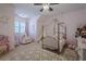 Pink bedroom with a canopy bed and unicorn decor at 4824 Archer Pl, Acworth, GA 30101