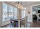 Bright dining area with built-in storage and view to backyard at 4824 Archer Pl, Acworth, GA 30101