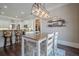Kitchen dining area with hardwood floors and modern light fixture at 4824 Archer Pl, Acworth, GA 30101