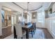 Elegant dining room features a rustic wood table and plenty of natural light at 4824 Archer Pl, Acworth, GA 30101