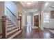 Hardwood floors and staircase greet you in this welcoming entryway at 4824 Archer Pl, Acworth, GA 30101