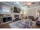Gathering room with built-in shelving and large TV at 4824 Archer Pl, Acworth, GA 30101
