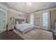 Spacious main bedroom with a king-size bed and trey ceiling at 4824 Archer Pl, Acworth, GA 30101